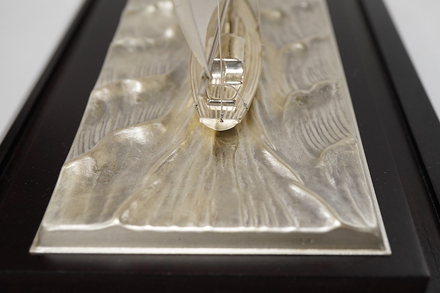 A modern sterling miniature model of 'Yacht No.6 Cutter' by Takehiko, in a presentation case, fixed on a wooden base, yacht dimensions approximately height 13.4cm, length 15cm, with box and pamphlet.